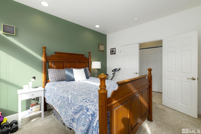 carpeted bedroom with a closet