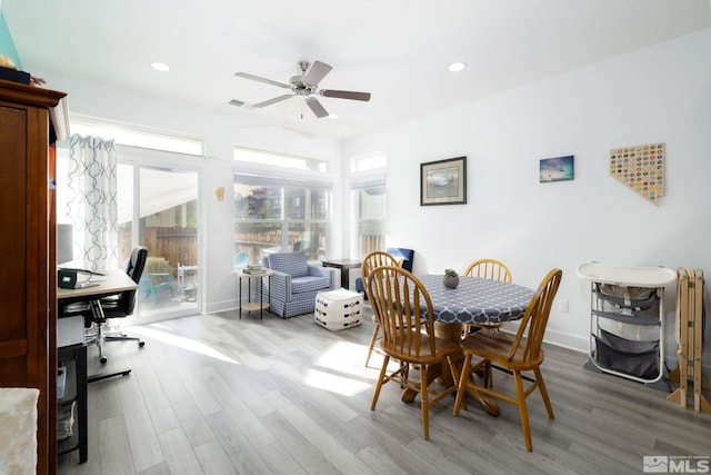 dining room with ceiling fan and hardwood / wood-style floors