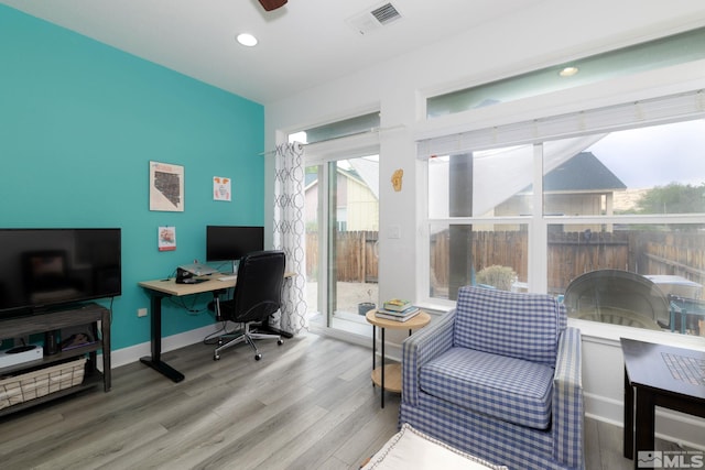 office space featuring hardwood / wood-style flooring and ceiling fan