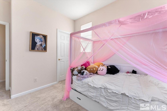 carpeted bedroom with vaulted ceiling