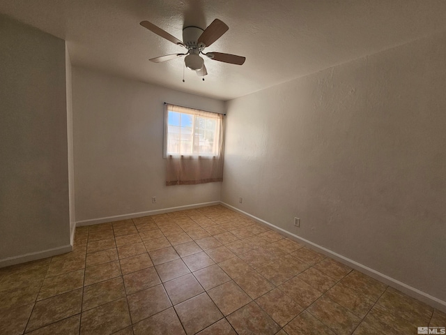 unfurnished room featuring light tile patterned flooring and ceiling fan