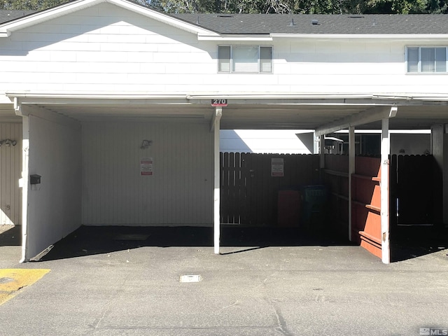 garage featuring a carport