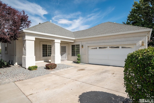 ranch-style home featuring a garage