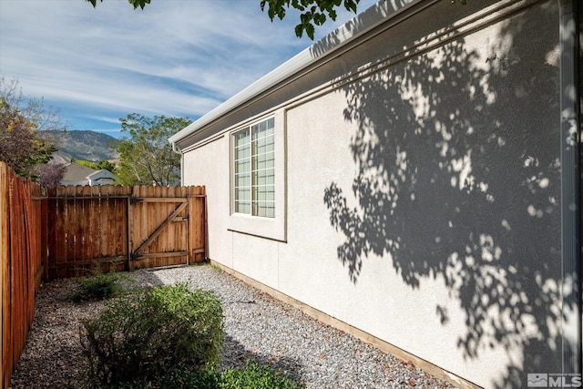 view of property exterior featuring a mountain view