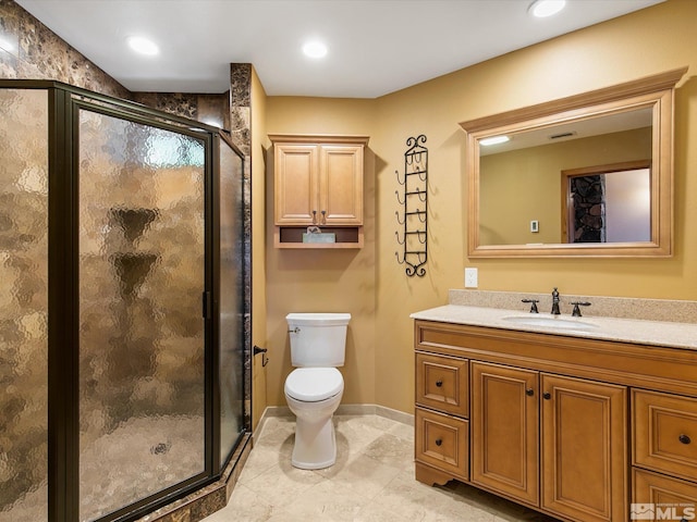 bathroom with tile patterned floors, an enclosed shower, toilet, and vanity