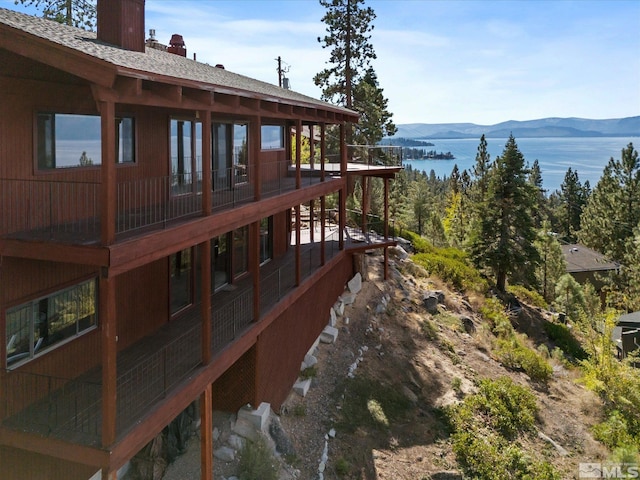 view of dock featuring a water and mountain view