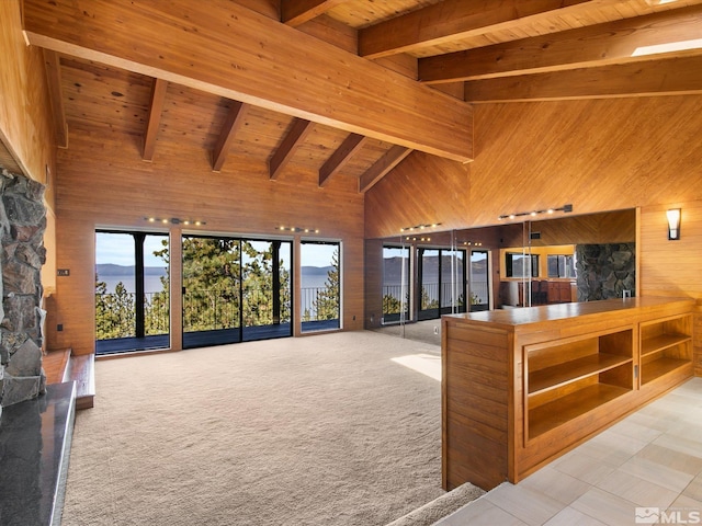 living room featuring light tile patterned floors, beam ceiling, high vaulted ceiling, and wooden ceiling