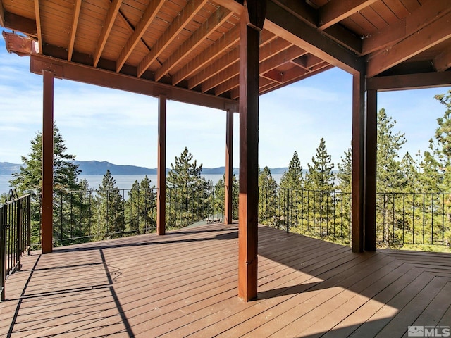 wooden deck with a mountain view