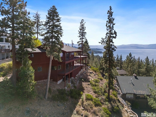 exterior space with a deck with mountain view