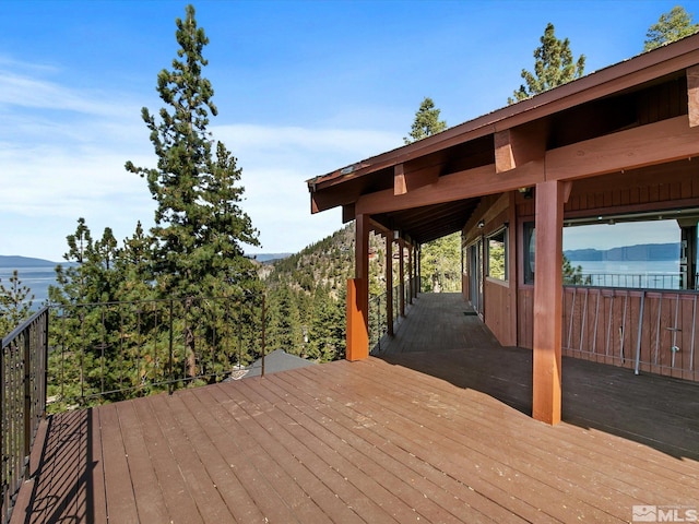 deck featuring a water and mountain view