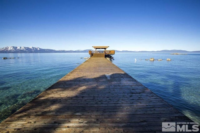 dock area with a water and mountain view