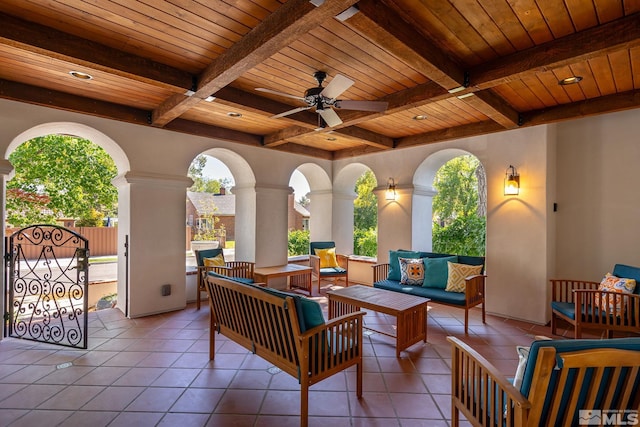 view of patio with an outdoor living space and ceiling fan