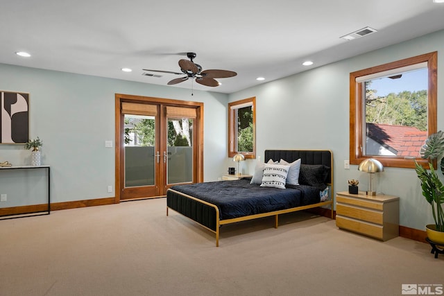 bedroom with access to exterior, light colored carpet, and ceiling fan