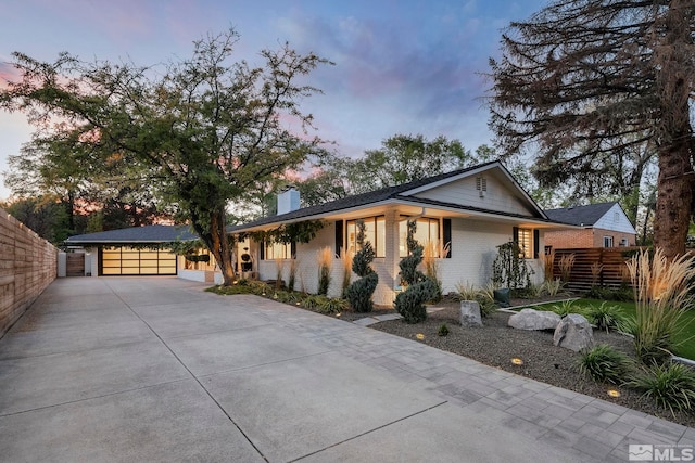 ranch-style house featuring a garage