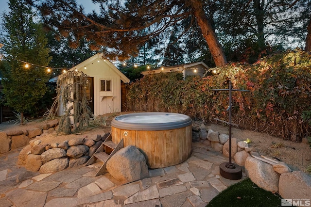 view of patio with a hot tub