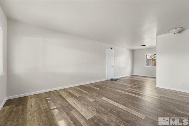 spare room featuring hardwood / wood-style floors