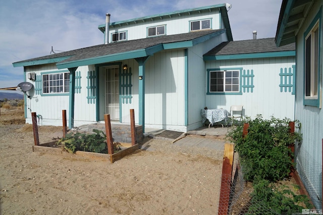 back of house with a patio