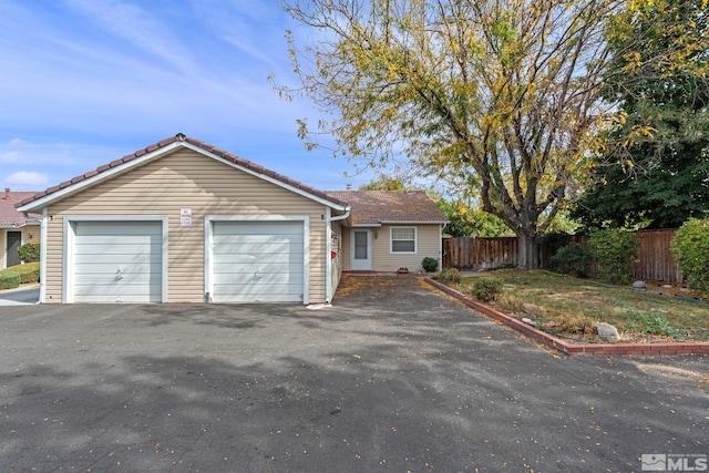 single story home with a garage