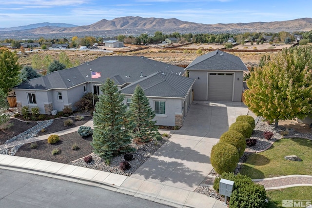 birds eye view of property featuring a mountain view