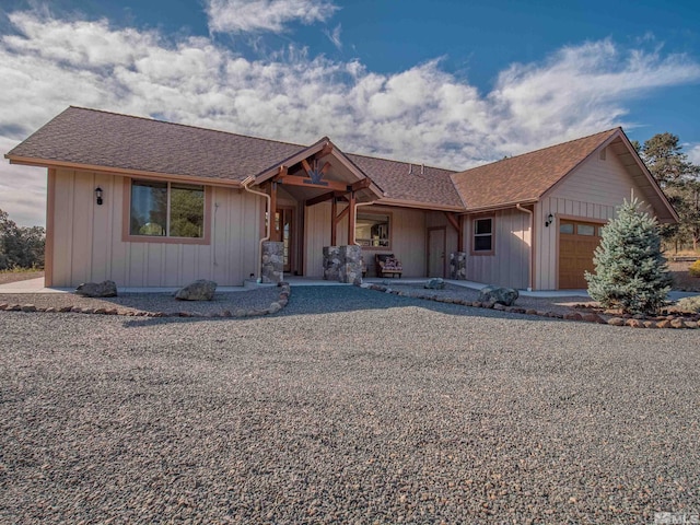 ranch-style house featuring a garage