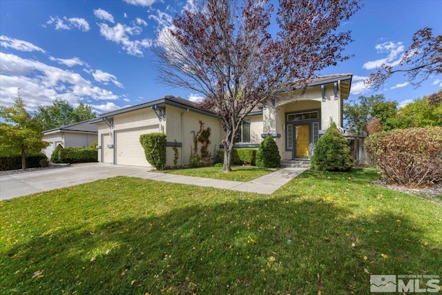 view of front of house featuring a front lawn and a garage