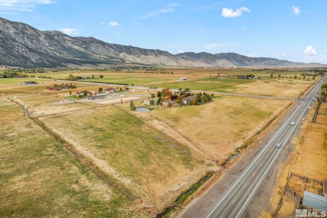 drone / aerial view with a mountain view and a rural view