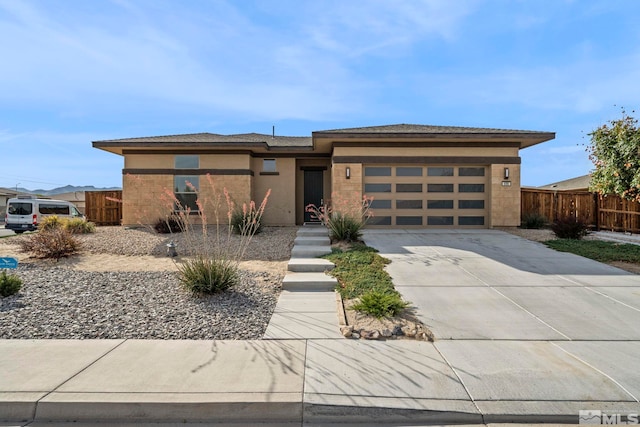 prairie-style house featuring a garage