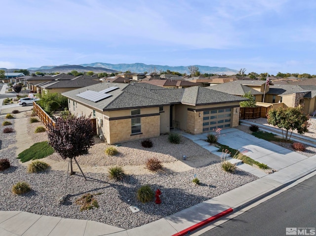 view of front of house featuring a mountain view and a garage