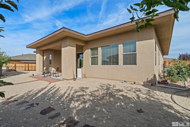 back of house featuring a patio