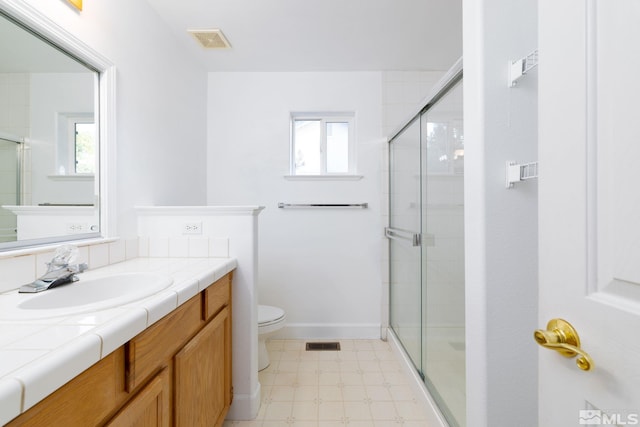bathroom with a shower stall, tile patterned floors, visible vents, and toilet