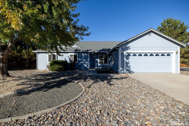 single story home featuring a garage and driveway