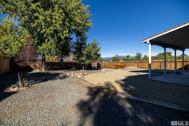 view of yard featuring a patio area and a fenced backyard