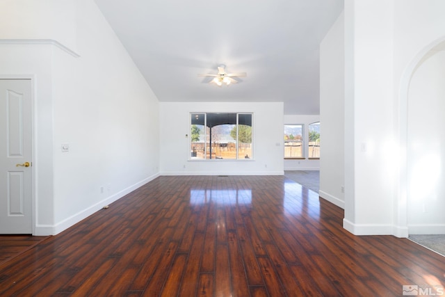 unfurnished living room featuring dark hardwood / wood-style floors and ceiling fan