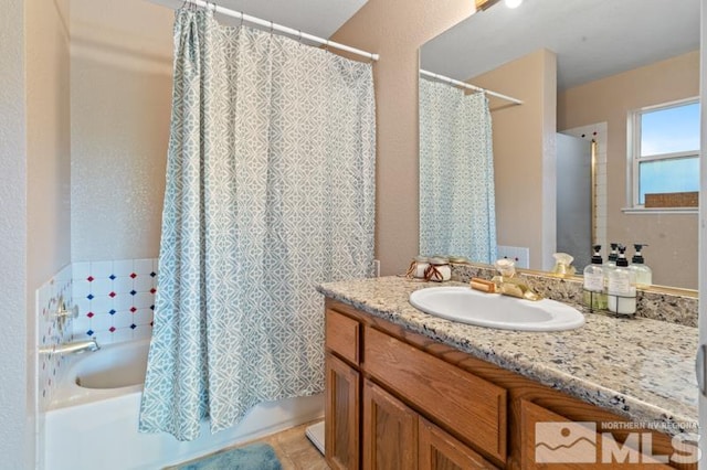 bathroom featuring vanity, shower / tub combo with curtain, and tile patterned flooring