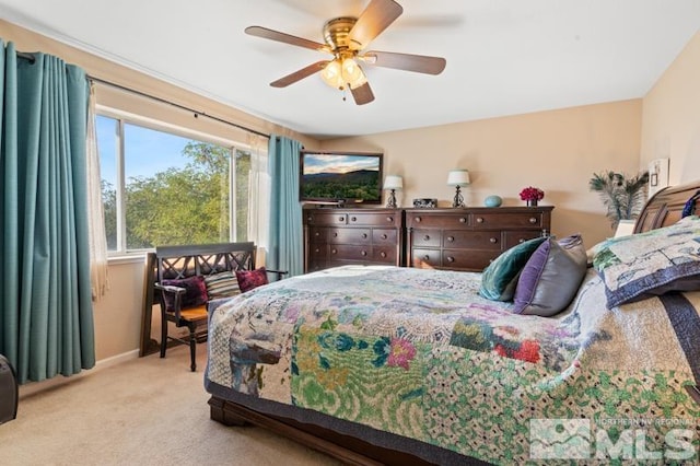 bedroom with light carpet and ceiling fan