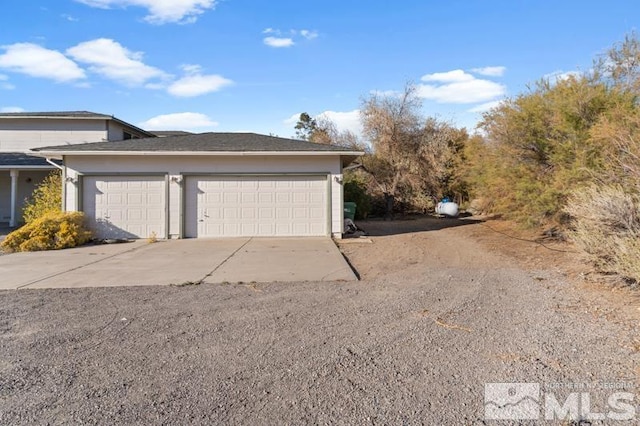 view of property exterior with a garage