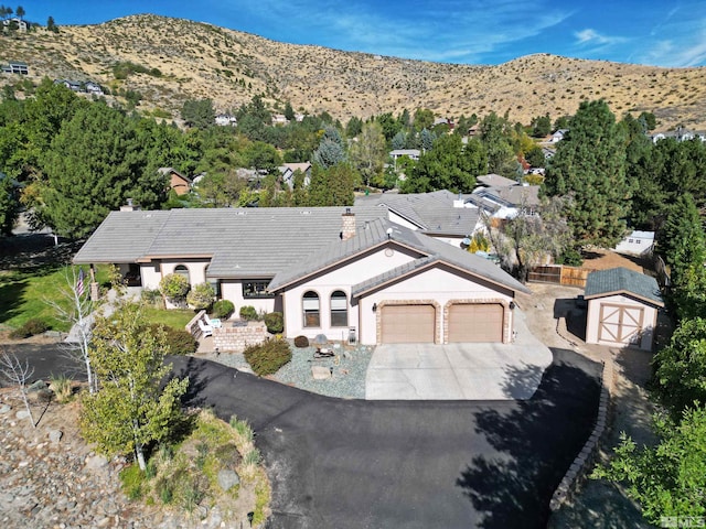 drone / aerial view featuring a mountain view