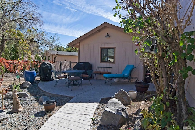 view of patio featuring a grill