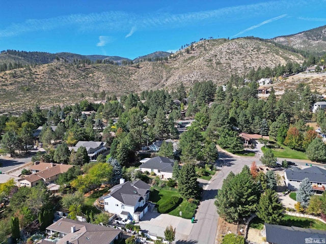 birds eye view of property featuring a mountain view