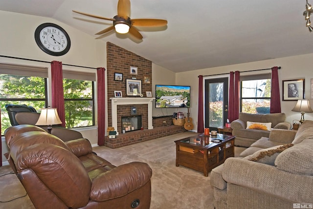 carpeted living room with a brick fireplace, ceiling fan, and vaulted ceiling