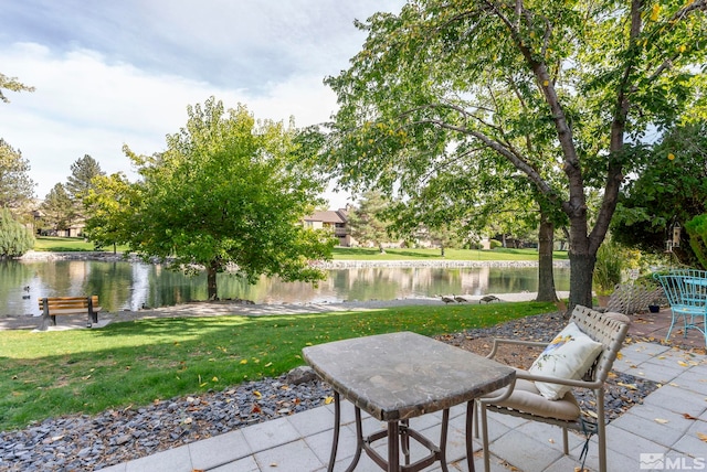 view of patio with a water view