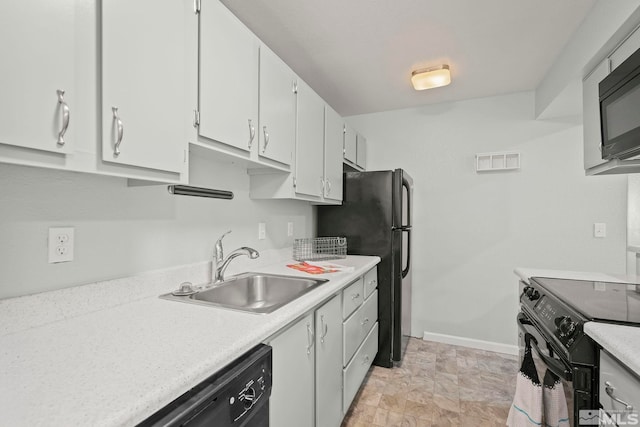 kitchen with black appliances, sink, and white cabinetry