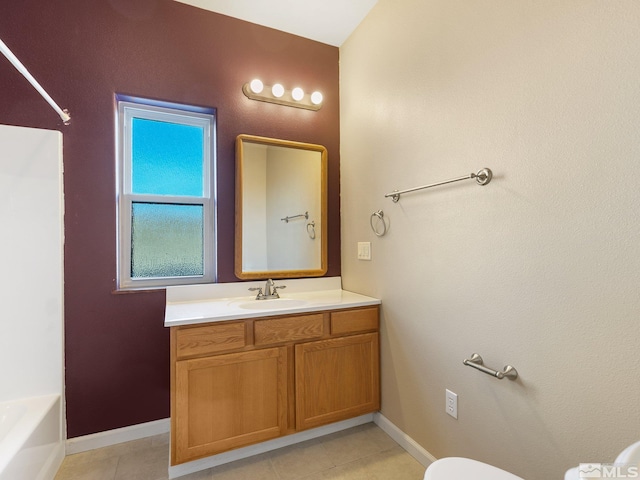 bathroom featuring vanity, toilet, and tile patterned floors
