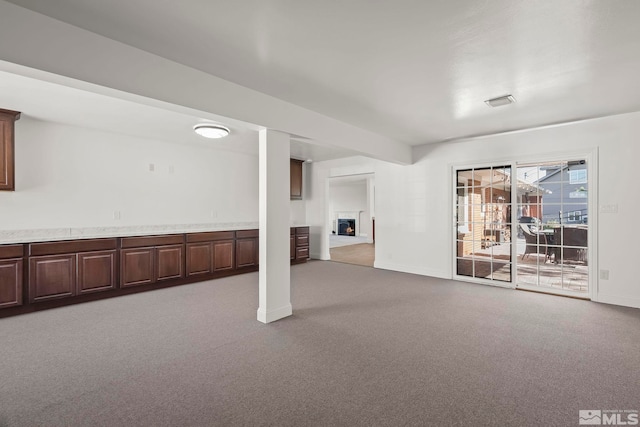 basement with carpet flooring