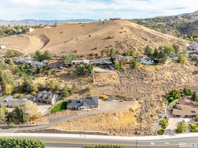 birds eye view of property featuring a mountain view