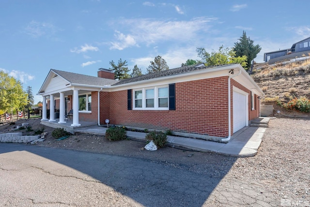 view of front of house with a garage and covered porch