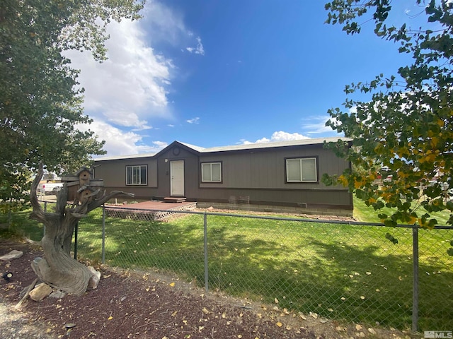 rear view of house with a lawn