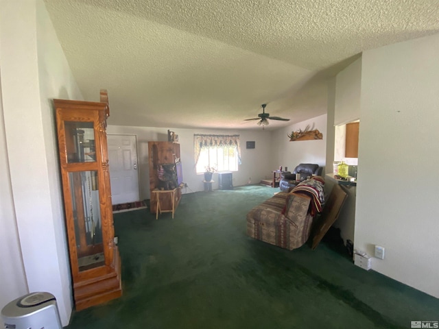 living room featuring a textured ceiling, ceiling fan, and carpet flooring