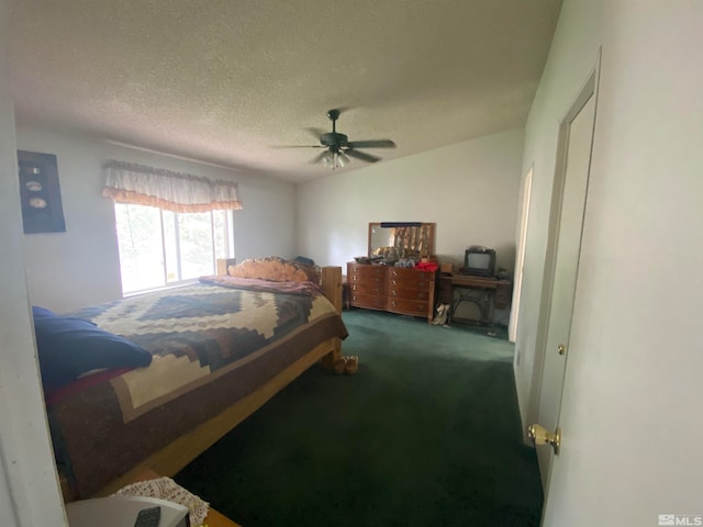 carpeted bedroom with ceiling fan and a textured ceiling