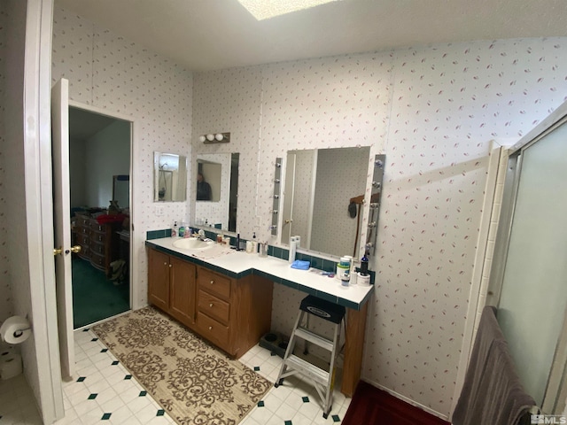 bathroom with vanity and an enclosed shower